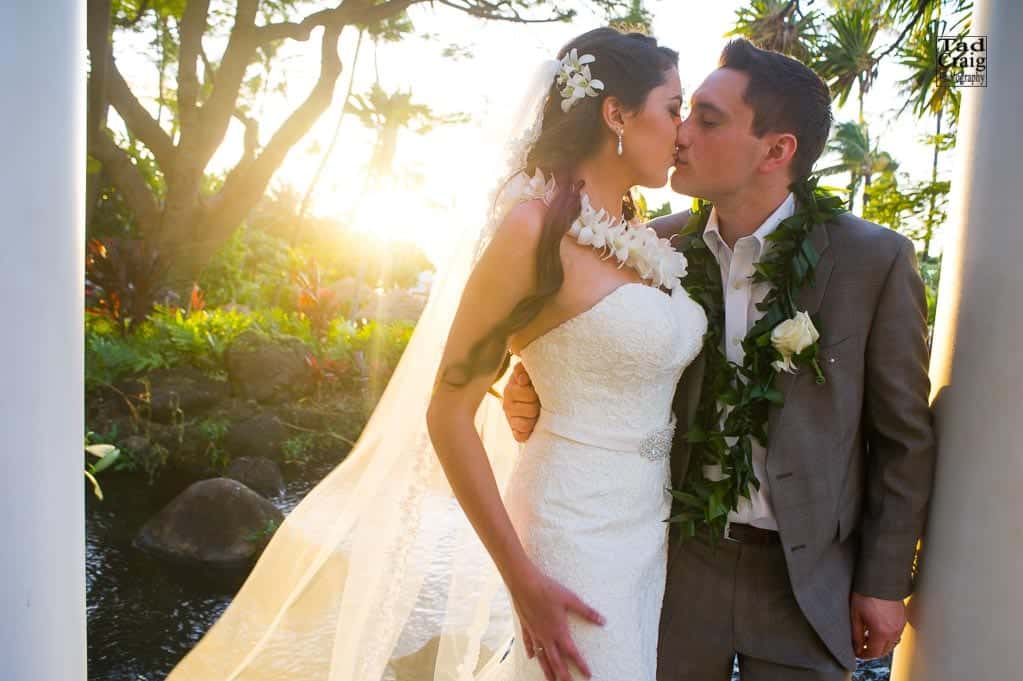 Couple eloping to Maui with sun setting behind them, taken by Maui Wedding Photography