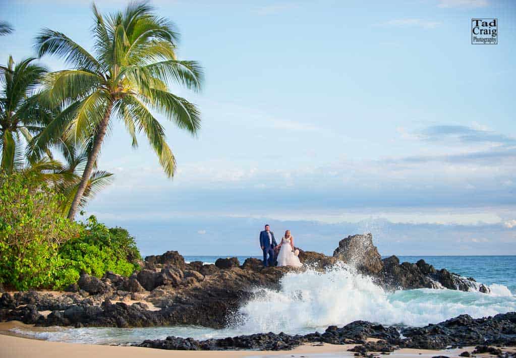 Couple on maui lava rocks after saying I Do at their Maui Elopement, Taken by Maui photographer