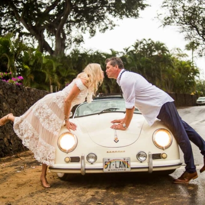 Happy Couple posing with a Vintage Porshe
