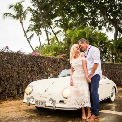Happy Couple posing with a Vintage Porshe