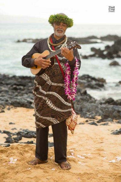 Ernest Puau playing ukulele at a wedding