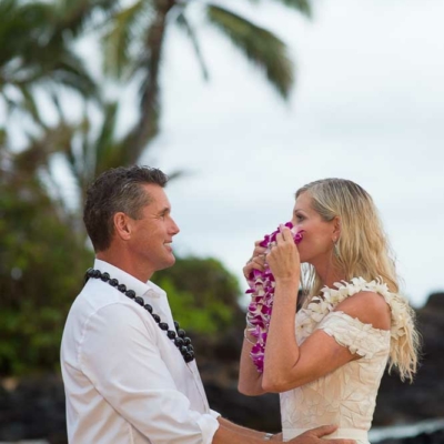 Happy Couple kissing after saying their vows on a beach in Maui