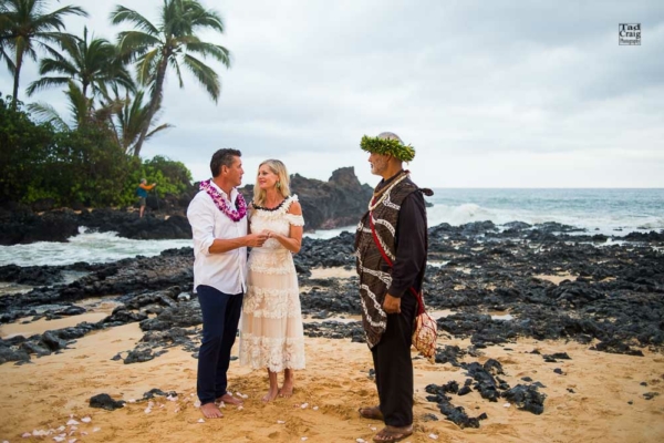 Happy Couple saying their vows on a beach in Maui