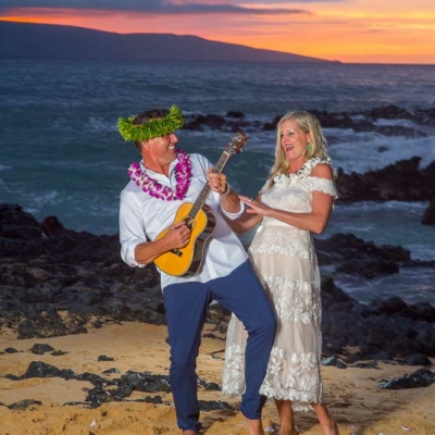 Happy Couple getting silly after saying their vows on a beach in Maui