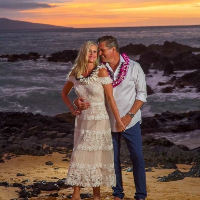 Happy Couple kissing after saying their vows on a beach in Maui