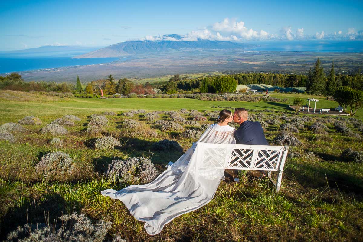 Couple Kissing with Maui Hawaii as the Background