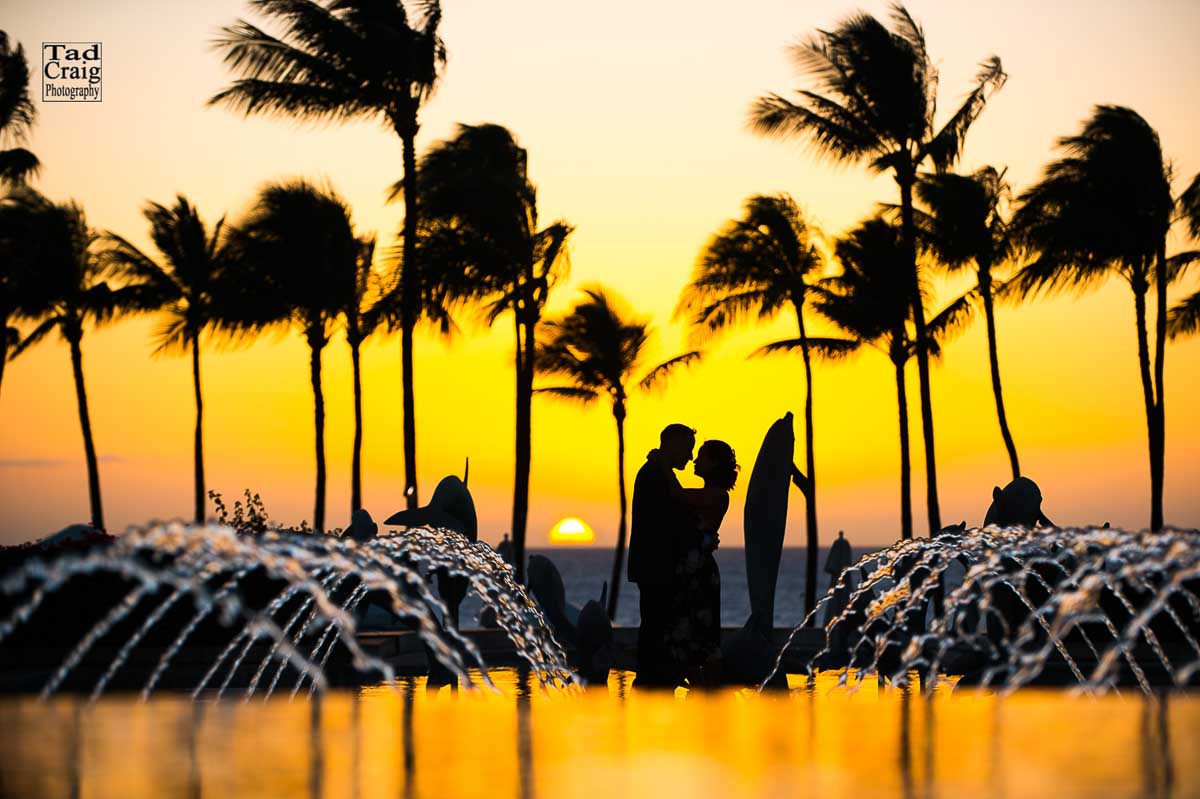 Siloutted couple at sunset with incredible sunset
