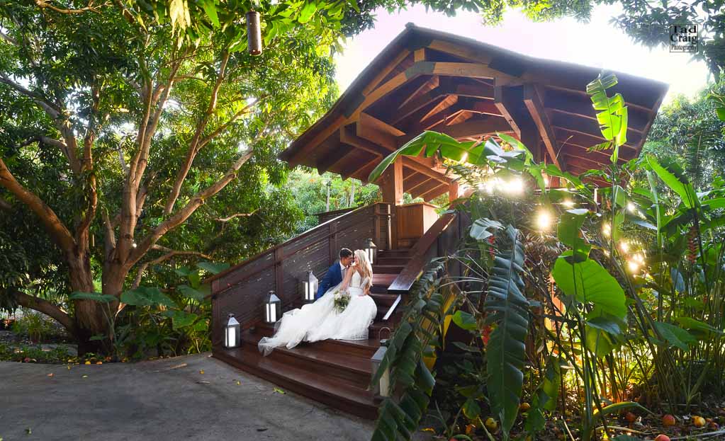The sweetest couple snuggling on the steps of the Tree House at The Hotel Wailea