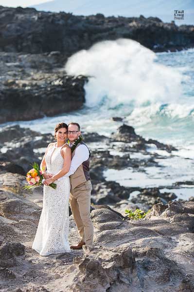 Adventuring couple on rocks in Maui Hawaii