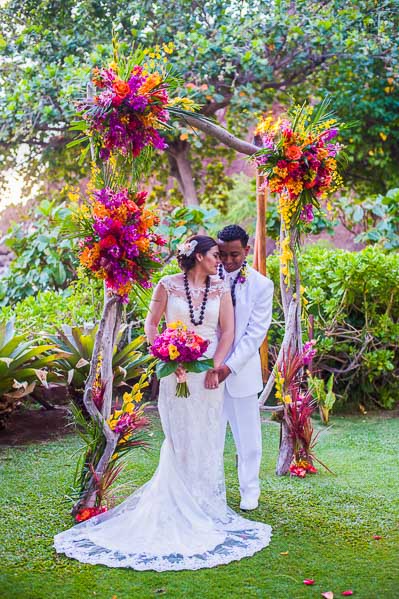 Just Married Couple in front of Gorgeous Maui Flower Arche